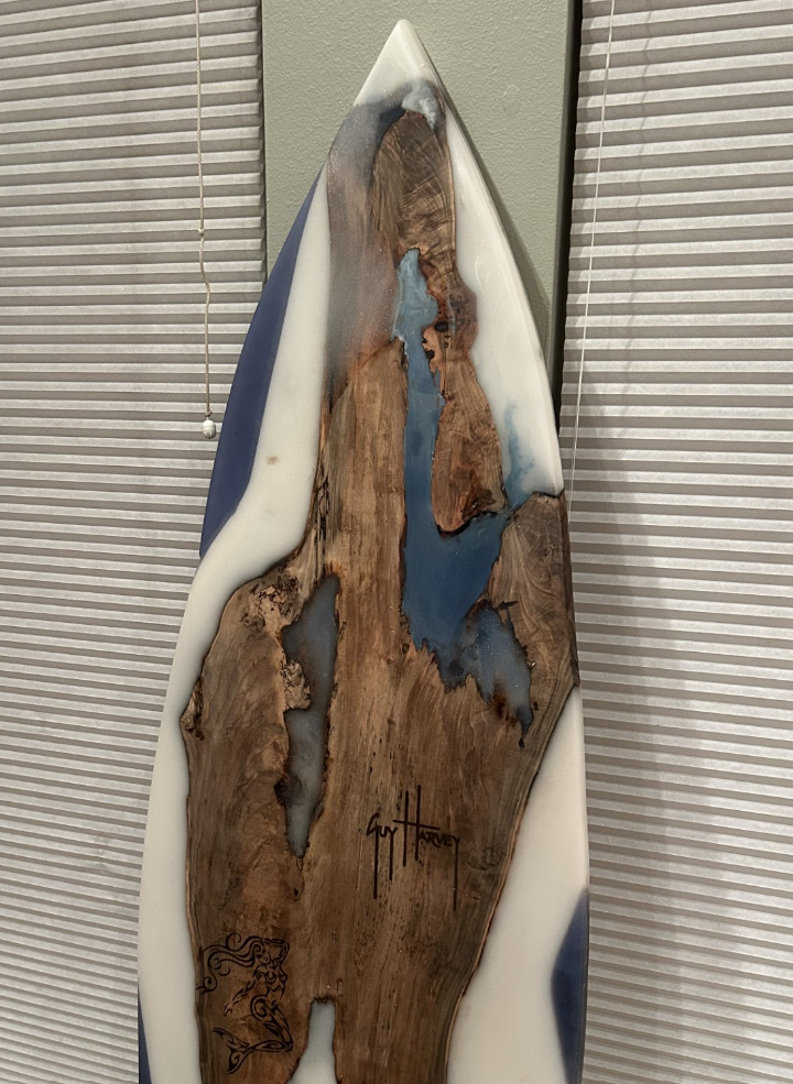 A Guy Harvey endorsed wooden surfboard that Matthew Docchio made