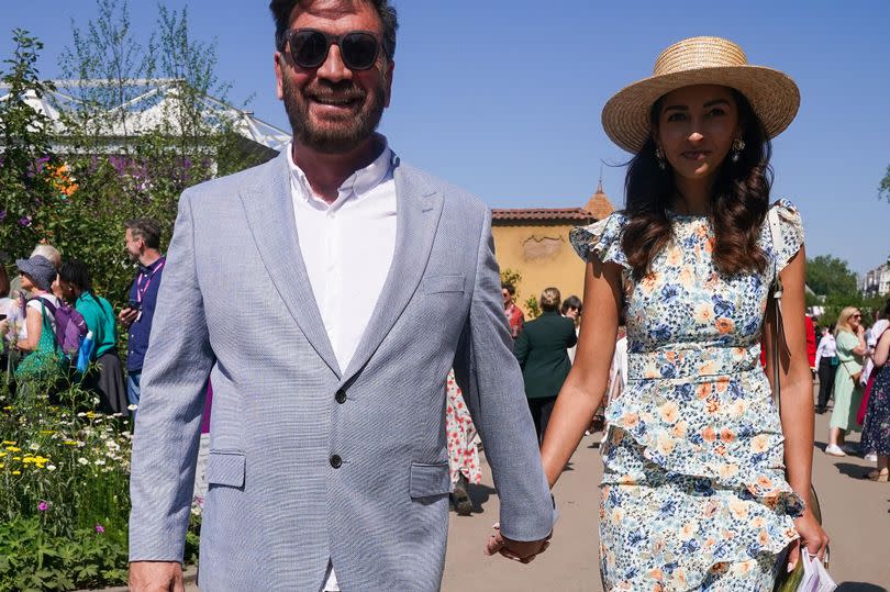 Pair stroll hand in hand as they made their way to the The Stroke Association's Garden For Recovery