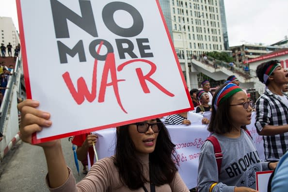 Ethnic Chin people hold placards during a protest asking for an end to conflict in Chin state and Rakhin State in Yangon in July, 2019. 