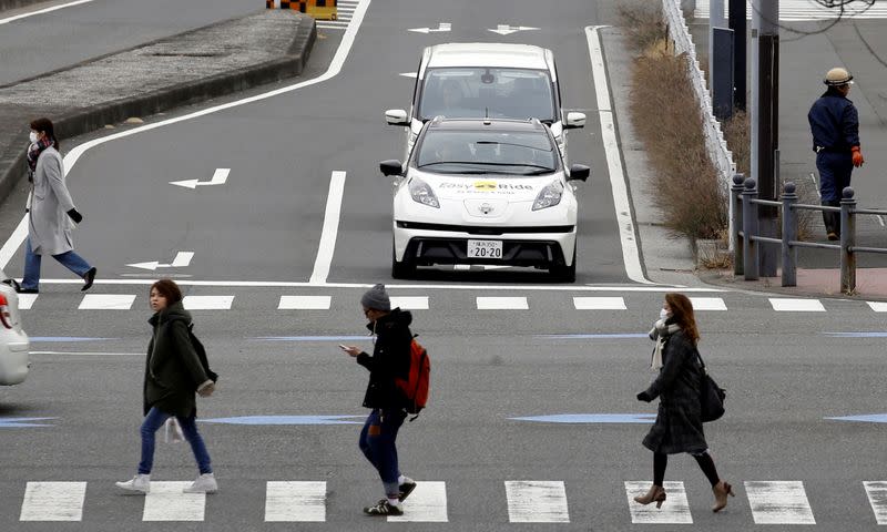 FILE PHOTO: A self-driving vehicle, based on Nissan Leaf EV, for Easy Ride service, developed by Nissan and mobile gaming platform operator DeNA Co, is seen during its media preview in Yokohama