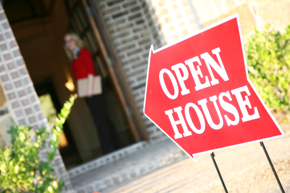 A realtor opening a house for viewing.See more from this series: