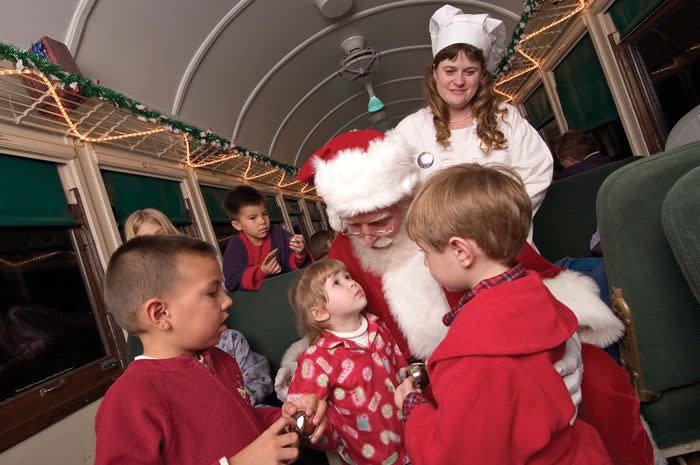 Santa and his helpers greet the children on the Polar Express. 