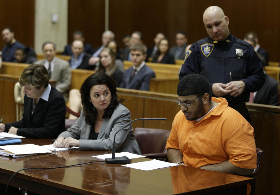 Jose Pimentel, bottom right, appears in a courtroom in New York, Wednesday, Feb. 19, 2014. Pimentel, accused of building homemade bombs to wage holy war in New York City, pleaded guilty Wednesday to a terrorism charge less than a week before his scheduled trial in a rare state-level terrorism case. With the plea, Pimentel, 29, was promised a sentence of 16 years in prison. He would have faced a minimum of 15 years to life if convicted of the top charge, a high-level weapons possession offense as a terrorism crime. (AP Photo/Seth Wenig, Pool)