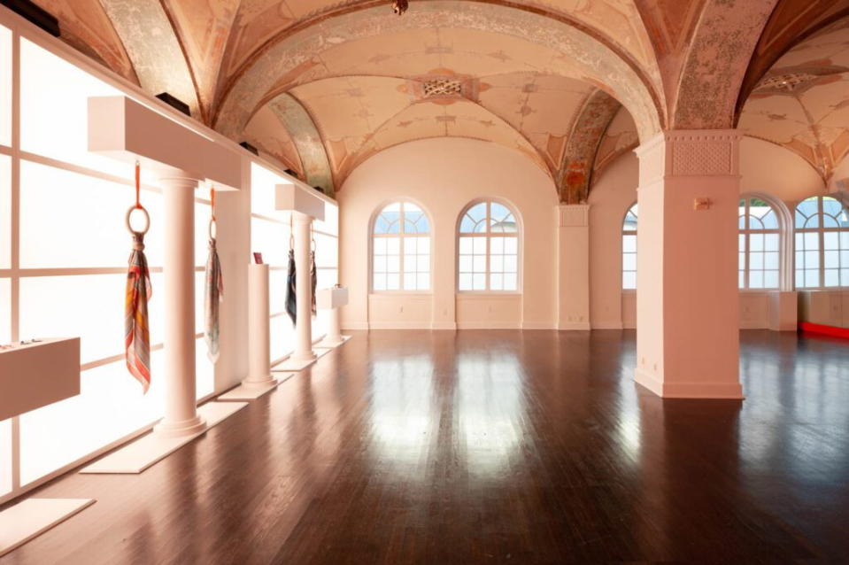 Calming white yoga studio inside Hermès' new pop-up gym space.