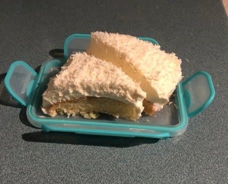 Two slices of cake on a Tupperware lid.