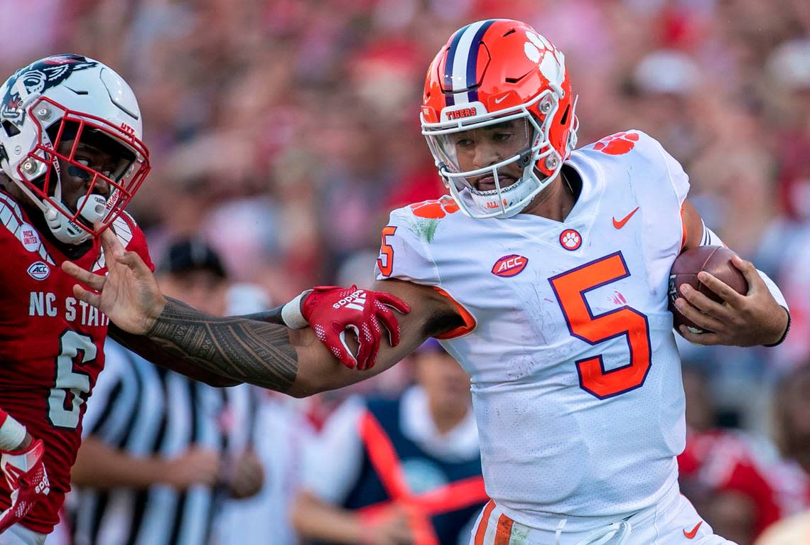 Clemson quarterback D.J. Uiagalelei breaks away from N.C. State’s Jakeen Harris (6) for a 37-yard gain in the fourth quarter on Saturday September 25, 2021 at Carter-Finley Stadium in Raleigh, N.C.