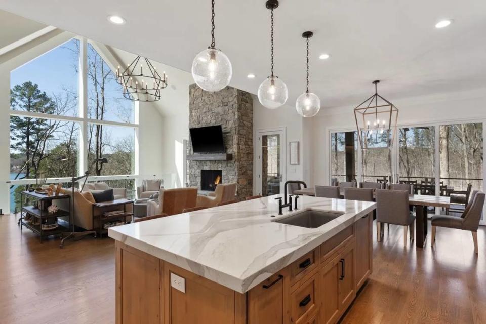 An image showing part of the great room, kitchen and dining area.