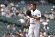 Seattle Mariners starting pitcher Yusei Kikuchi communicates with catcher Tom Murphy during the fourth inning of a baseball game against the Houston Astros, Wednesday, July 28, 2021, in Seattle. (AP Photo/Jason Redmond)