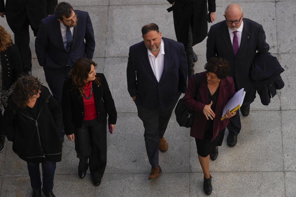 The leader of the Catalonian ERC party Oriol Junqueras, center, arrives at the Spanish Parliament in Madrid, Spain, Thursday, March 14, 2024. Prime Minister Pedro Sánchez has promoted the amnesty as a way to move past a secession attempt by the then-leaders of Catalonia, a northeastern region centered around Barcelona where many speak the local Catalan language as well as Spanish. (AP Photo/Manu Fernandez)