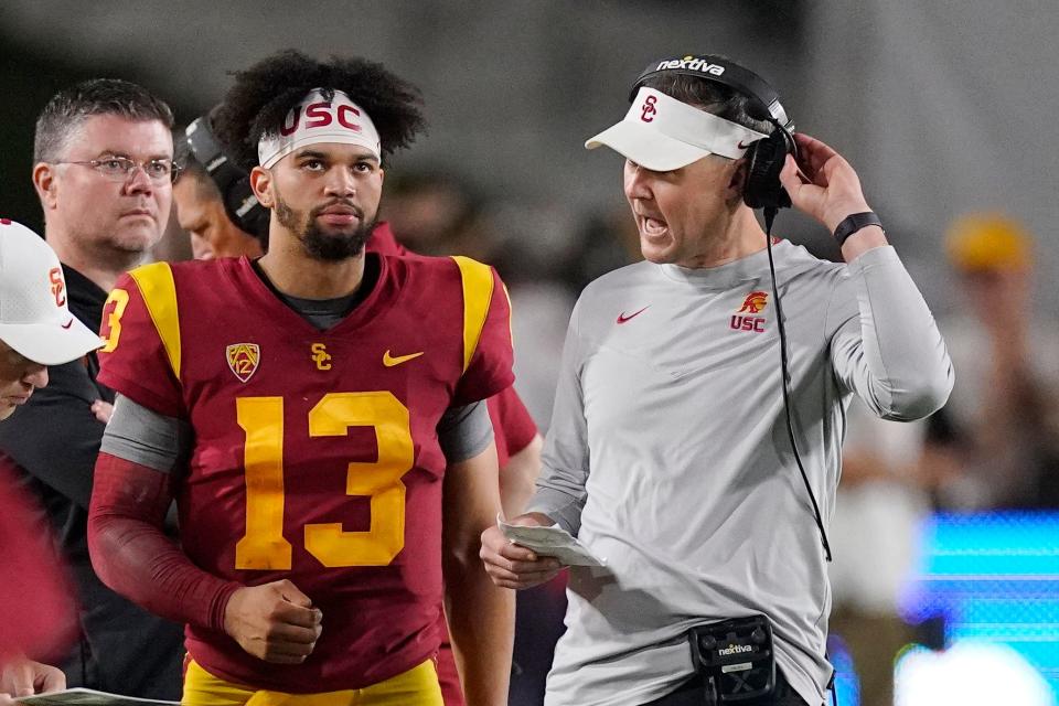 Southern California quarterback Caleb Williams, left, and head coach Lincoln Riley rolled over Arizona State in the second half of last year's game.