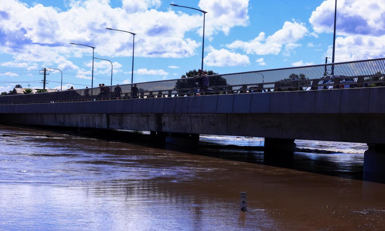 <span>A submerged indicator passing 6 metres under the Windsor Bridge in Sydney’s west on Saturday.</span><span>Photograph: Jenny Evans/Getty Images</span>