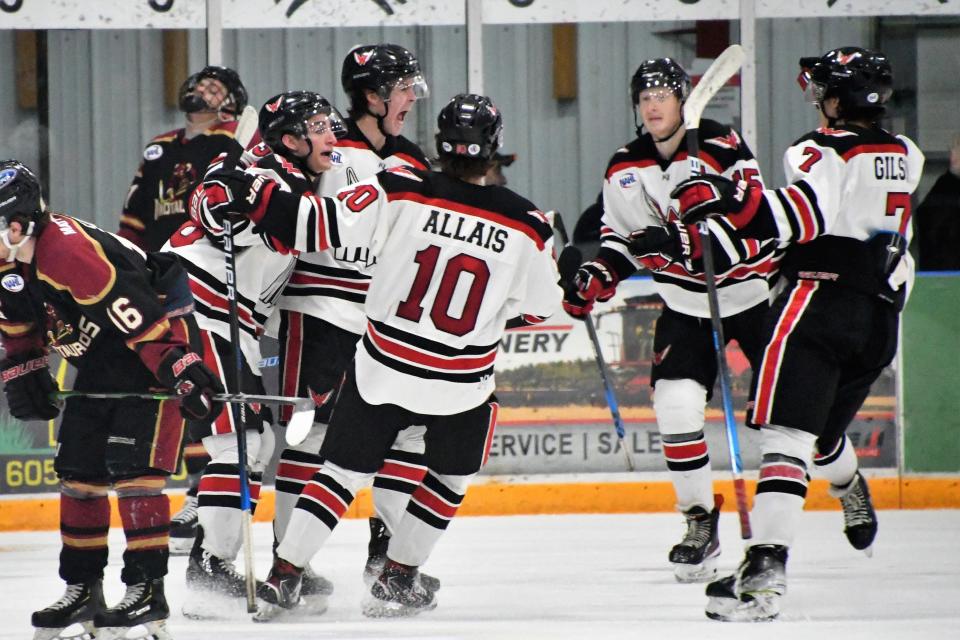 The Aberdeen Wings celebrate during Saturday night's 4-2 victory over Minot Saturday night at the Odde Ice Center.