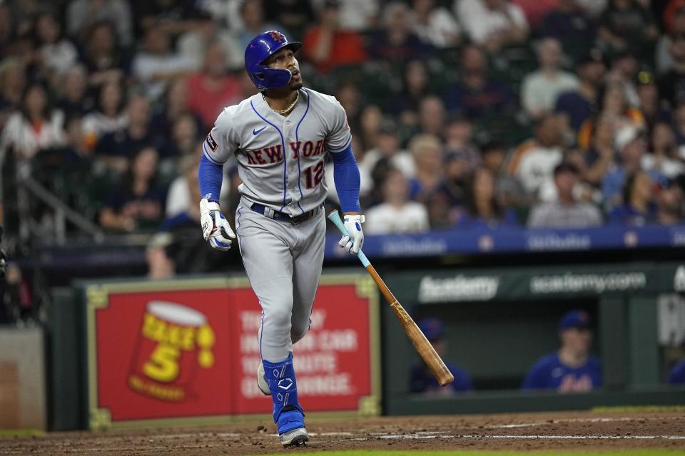 New York Mets' Francisco Lindor (12) watches his three-run home run against the Houston Astros during the third inning of a baseball game Monday, June 19, 2023, in Houston. (AP Photo/David J. Phillip)