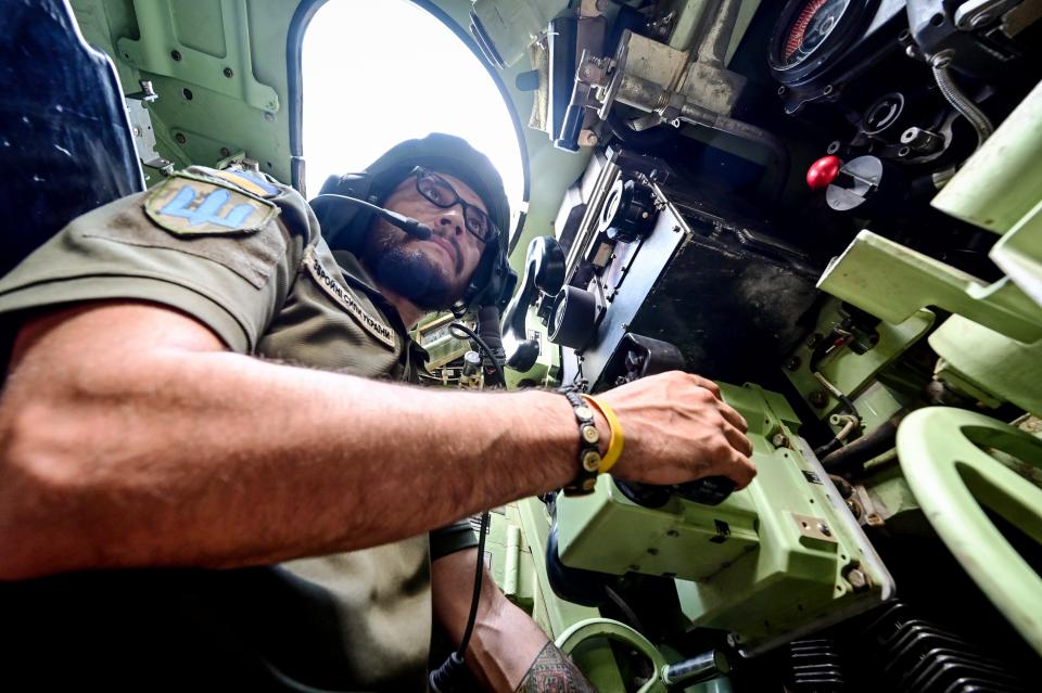 Gunner 'Molfar', 39, a Bradley IFV crew member of the 47th Magura Mechanized Brigade who took part in the fighting to liberate Robotyne village from Russian invaders, is pictured inside the vehicle in the southeastern Zaporizhzhia direction.