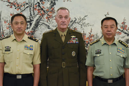 Chairman of the US Joint Chiefs of Staff, General Joseph Dunford (C) and Chinese vice chairman of the Central Military Commission Fan Changlong (R) in Beijing on August 17, 2017. REUTERS/Wang Zhao/Pool