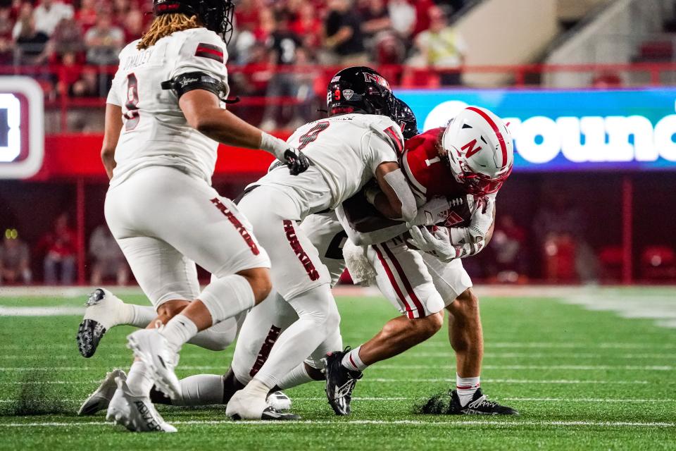 Nebraska Cornhuskers wide receiver Billy Kemp IV (1) is tackled by Northern Illinois Huskies safety Nate Valcarcel (9) during the fourth quarter at Memorial Stadium.