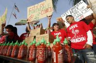 Sriracha hot sauce workers protest ahead of the city council meeting in Irwindale, Calif., Wednesday, April 23, 2014. The Irwindale City Council has declared that the factory that produces the popular Sriracha hot sauce is a public nuisance. (AP Photo/Damian Dovarganes)