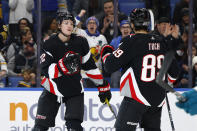 Buffalo Sabres center Tage Thompson (72) celebrates after his goal with right winger Alex Tuch (89) during the first period of an NHL hockey game against the San Jose Sharks, Sunday, Dec. 4, 2022, in Buffalo, N.Y. (AP Photo/Jeffrey T. Barnes)