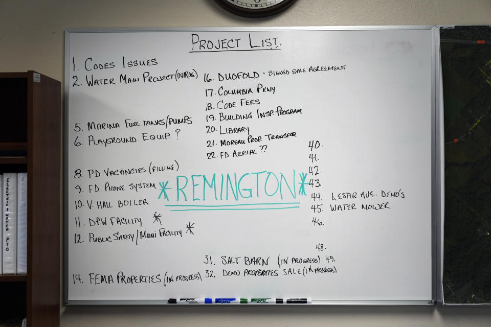 "Remington" is the biggest item on a project list displayed in Ilion Mayor John Stephens' office in Ilion, N.Y., Thursday, Feb. 1, 2024. The nation’s oldest gun-maker is consolidating operations in Georgia and recently announced plans to shutter the Ilion factory in early March. (AP Photo/Seth Wenig)