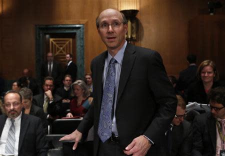 The Federal Reserve's Division of Banking and Supervision and Regulation Director Michael Gibson arrives to testify on physical commodities before the Senate Banking subcommittee on financial institutions and consumer protection on Capitol Hill in Washington, January 15, 2014. REUTERS/Yuri Gripas