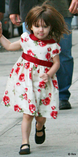 Where is Suri off to in such a rush (and in such an adorable dress)? Ice cream van? A D&G sample sale? Who can tell these days! (NYC, October 2008)