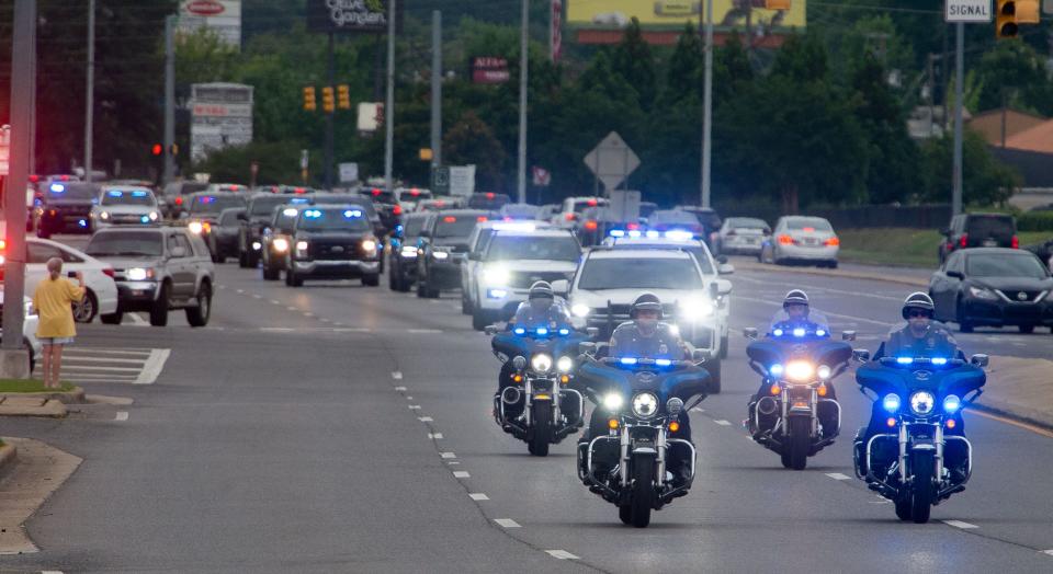 June 10, 2022; Tuscaloosa, AL, USA; Officers from across West Alabama and East Mississippi escort the body of Meridian Police Officer Kennis Croom, a Tuscaloosa native, to a funeral home in Northport Friday evening on McFarland Blvd.  Gary Cosby Jr.-The Tuscaloosa News