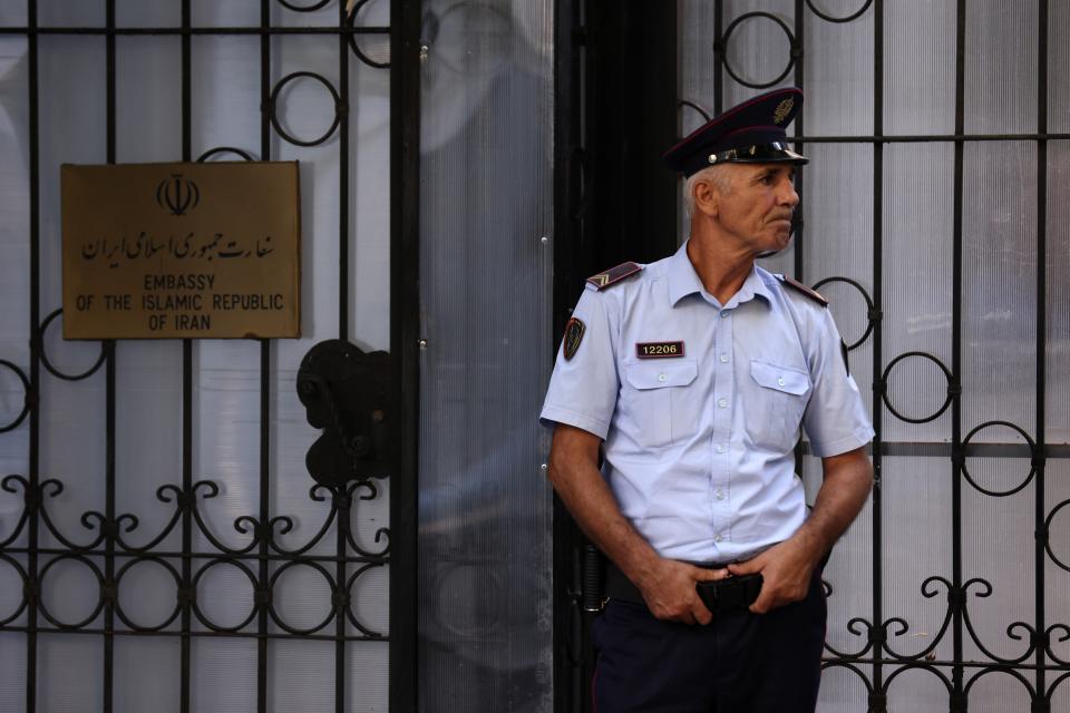 A policeman stands guard outside the Iranian Embassy in Tirana, Albania, Wednesday, Sept. 7, 2022. Albania cut diplomatic ties with Iran and expelled the country's embassy staff over a major cyberattack nearly two months ago that was allegedly carried out by Tehran on Albanian government websites, the prime minister said Wednesday. (AP Photo/Franc Zhurda)