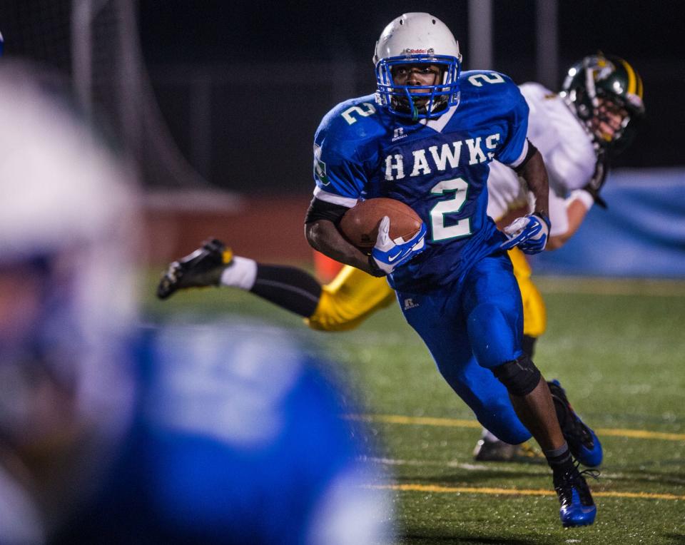 Saint Georges' Keyjuan Selby cuts up field away from Indian River defenders in their DIAA Division II playoff game at Appoquinimink High School on Friday night, November 15, 2013.