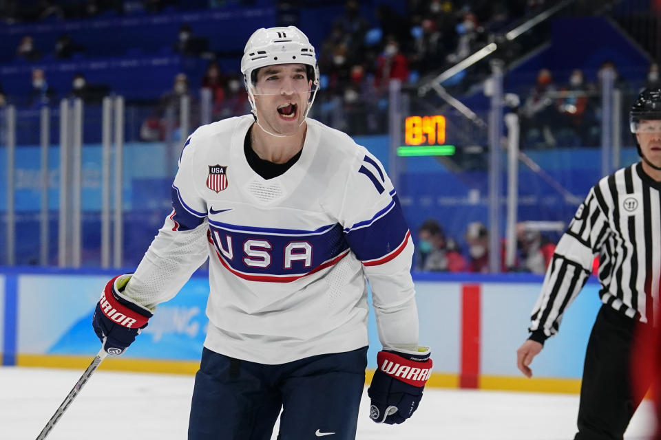 United States' Kenny Agostino celebrates after scoring a goal against Canada during a preliminary round men's hockey game at the 2022 Winter Olympics, Saturday, Feb. 12, 2022, in Beijing. (AP Photo/Matt Slocum)