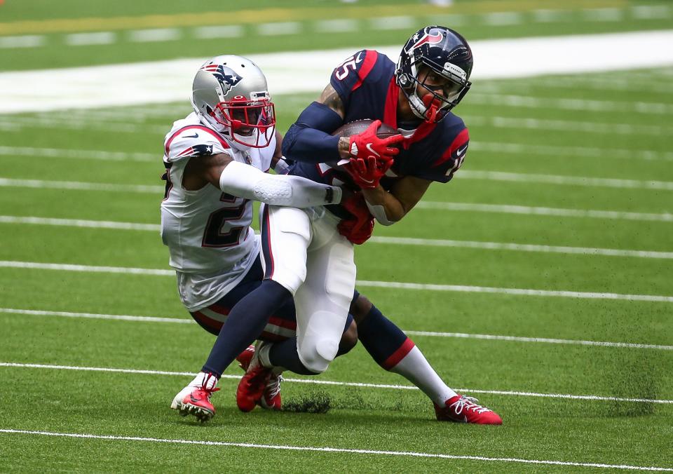 Patriots cornerback J.C. Jackson tackles Texans wide receiver Will Fuller during a game in November 2020.