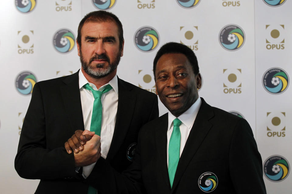 Soccer legends, New York Cosmos' Director of Soccer Eric Cantona, left, and Honorary President Pele pose during the announcement of  the New York Cosmos Opus in London, Tuesday, Aug. 2, 2011. The New York Cosmos Opus is the definitive publication on one of the world's most glamorous soccer franchises. New York Cosmos is due to play Manchester United in a Paul Scholes testimonial match at Old Trafford on Friday, the first U.S. team to play at the stadium. (AP Photo/Sang Tan)