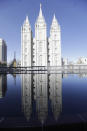 FILE - In this April 4, 2020 file photo, the Salt Lake Temple at Temple Square is shown during The Church of Jesus Christ of Latter-day Saints' twice-annual church conference in Salt Lake City. For the third consecutive time, The Church of Jesus Christ of Latter-day Saints will hold its signature conference this weekend without attendees in person as the faith continues to take precautions amid the pandemic. Members of the Utah-based faith will instead watch on TVs, computers and tablets from their homes around the world Saturday, April 3, 2021 to hear spiritual guidance from the religion's top leaders, who will be delivering the speeches in Salt Lake City. (AP Photo/Rick Bowmer)