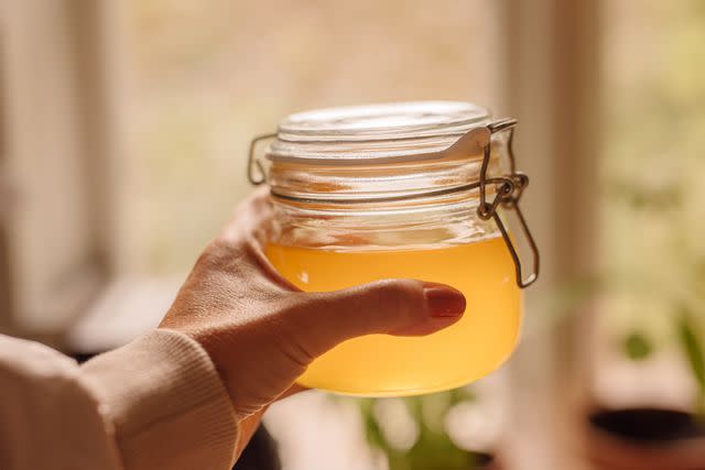 <p>knape / Getty Images</p> Ghee clarified butter in jar