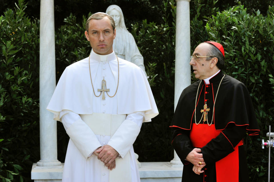 This image released by HBO shows Jude Law, left, and Silvio Orlando from the HBO series, "The Young Pope," premiering Sunday at 9 p.m. EST. (Gianni Fiorito/HBO via AP)