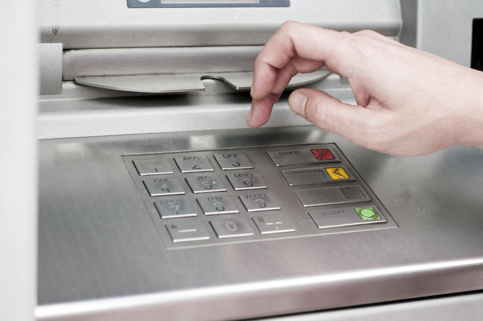 ATM Machine and Mans Hand