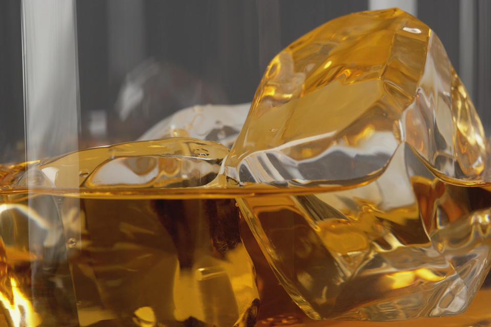 Luxury ice cubes in a glass with liquor