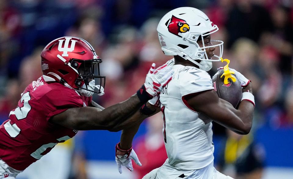 Louisville Cardinals wide receiver Jamari Thrash (1) rushes into the end zone for a touchdown past Indiana Hoosiers defensive back Jamari Sharpe (22) on Saturday, Sept. 16, 2023, during the game at Lucas Oil Stadium in Indianapolis. The Louisville Cardinals lead at the half against the against the Indiana Hoosiers, 21-0.