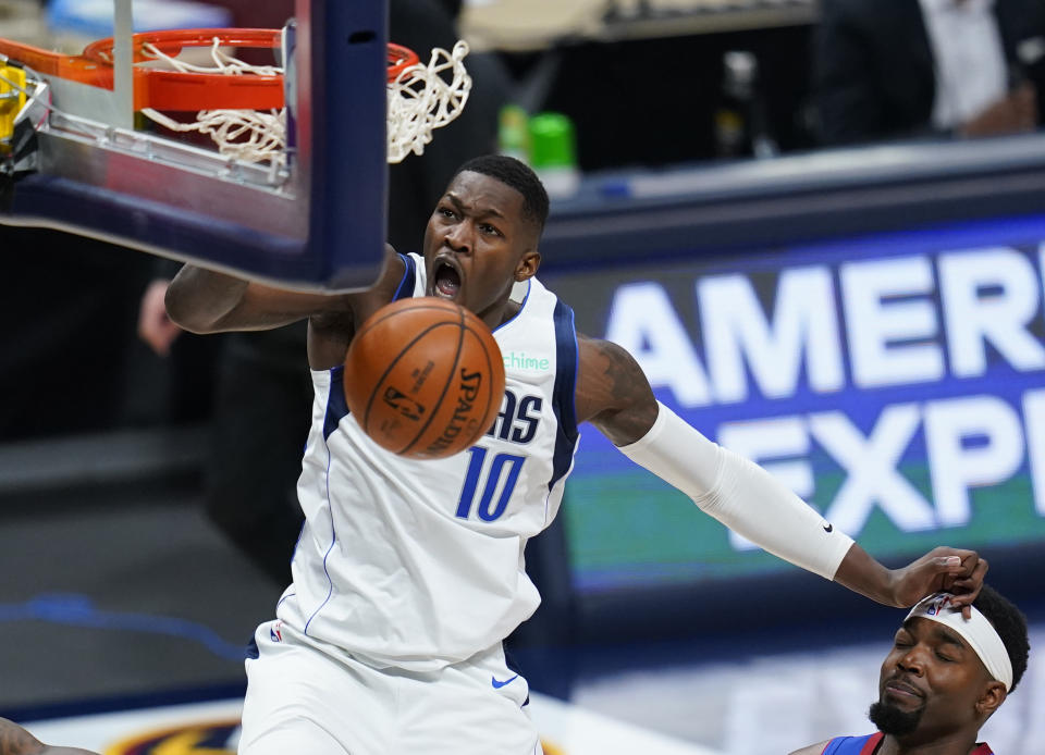 Dallas Mavericks forward Dorian Finney-Smith (10) dunks against the Denver Nuggets during the second quarter of an NBA basketball game Thursday, Jan. 7, 2021, in Denver. (AP Photo/Jack Dempsey)