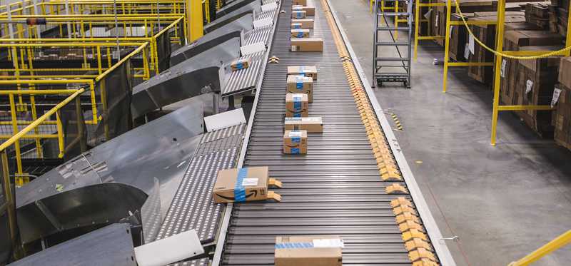 Boxes on a conveyor belt in Amazon's fulfillment center.