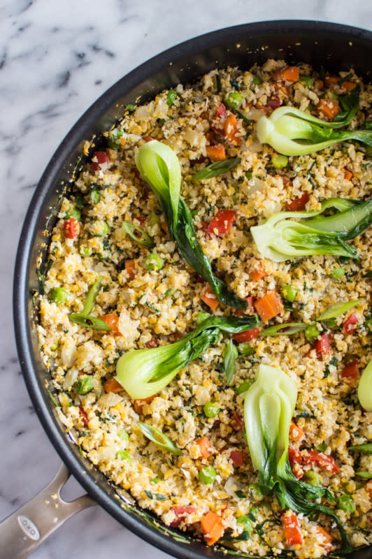 <p>This paleo-friendly cauliflower fried rice is ready in less than 30 minutes! It’s a great lighter alternative to traditional fried rice!</p><p><strong>Get the recipe: <a href="https://healthynibblesandbits.com/cauliflower-fried-rice-with-baby-bok-choy/" rel="nofollow noopener" target="_blank" data-ylk="slk:Cauliflower Fried Rice with Baby Bok Choy;elm:context_link;itc:0;sec:content-canvas" class="link "><em>Cauliflower Fried Rice with Baby Bok Choy</em></a></strong></p>