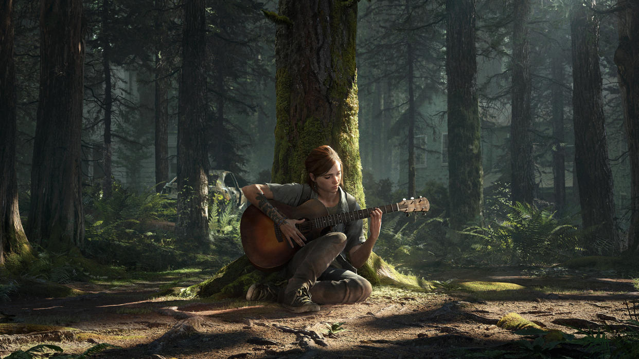  Ellie playing the guitar under a tree in The Last of Us 2. 