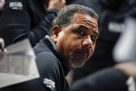 Providence coach Ed Cooley speaks with his team during a timeout during the first half of an NCAA college basketball game against Xavier, Wednesday, Jan. 26, 2022, in Cincinnati. (AP Photo/Jeff Dean)