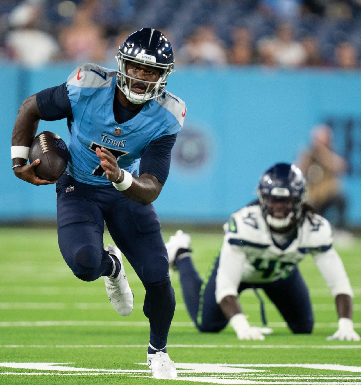 Tennessee Titans quarterback Malik Willis runs against the Seattle Seahawks.