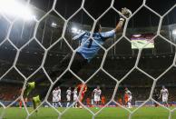 Costa Rica's goalkeeper Keilor Navas jumps to save the ball during their 2014 World Cup quarter-finals against the Netherlands at the Fonte Nova arena in Salvador July 5, 2014. REUTERS/Marcos Brindicci