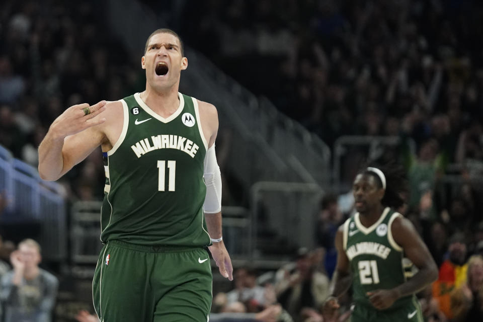 Milwaukee Bucks' Brook Lopez (11) reacts after making a basket during the first half of an NBA basketball game against the Philadelphia 76ers, Saturday, March 4, 2023, in Milwaukee. (AP Photo/Aaron Gash)