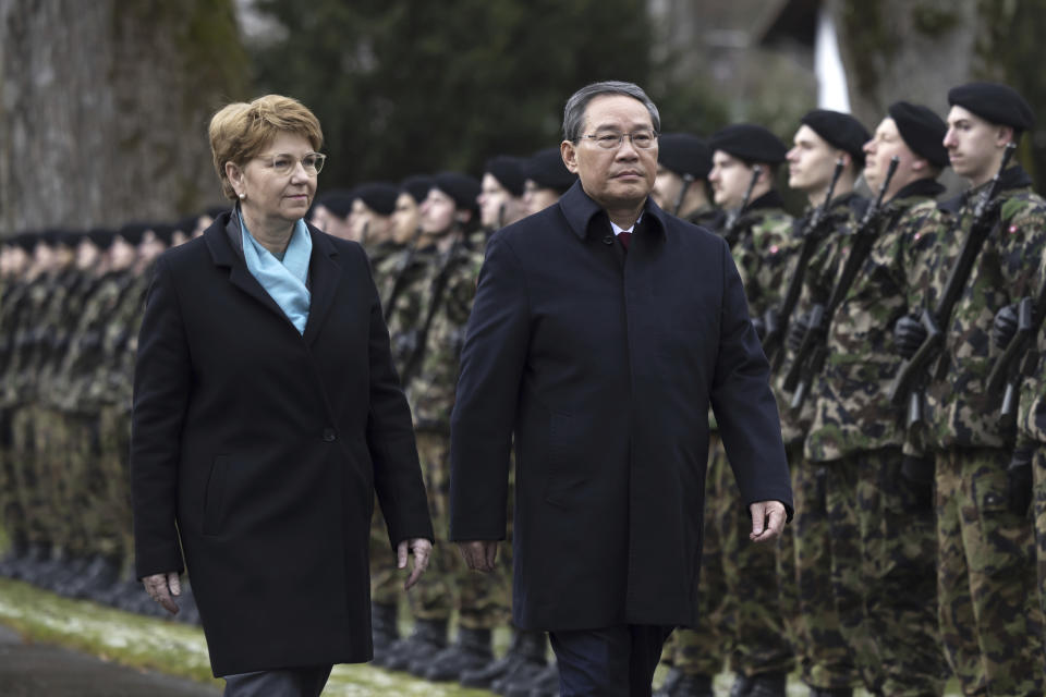 Swiss President Viola Amherd, left, and Chinese Prime Minister Li Qiang inspect the guard of honour in Kehrsatz, near Bern, Switzerland, Monday, Jan. 15, 2024. Chinese Prime Minister Li Qiang is visiting Switzerland to attend the World Economic Forum in Davos. (Peter Klaunzer/Keystone via AP)