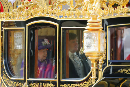 Britain's Queen Elizabeth, and King Willem-Alexander of the Netherlands travel in a carriage during a state visit of King Willem-Alexander and Queen Maxima of the Netherlands to the United Kingdom, in London, Britain October 23, 2018. Christopher Furlong/Pool via REUTERS