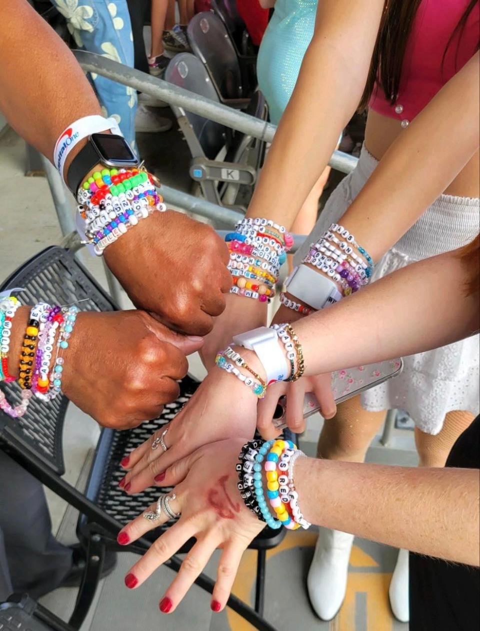Fans of Taylor Swift display their friendship bracelets at the pop icon's concert on June 17 at Acrisure Stadium in Pittsburgh.