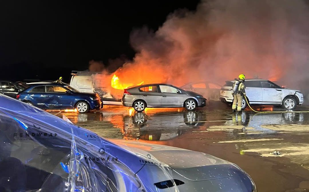 Essex County Fire and Rescue Service firefighters extinguish a blaze caused by an electric vehicle at a salvage yard in Rochford in March
