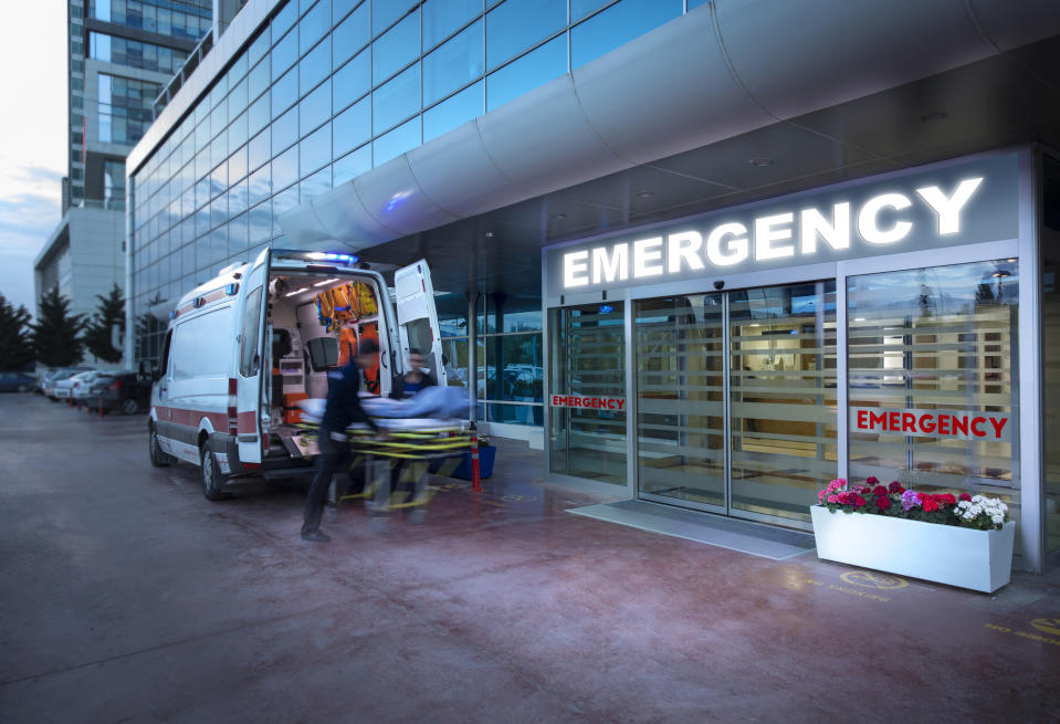 An ambulance outside of a hospital's emergency room